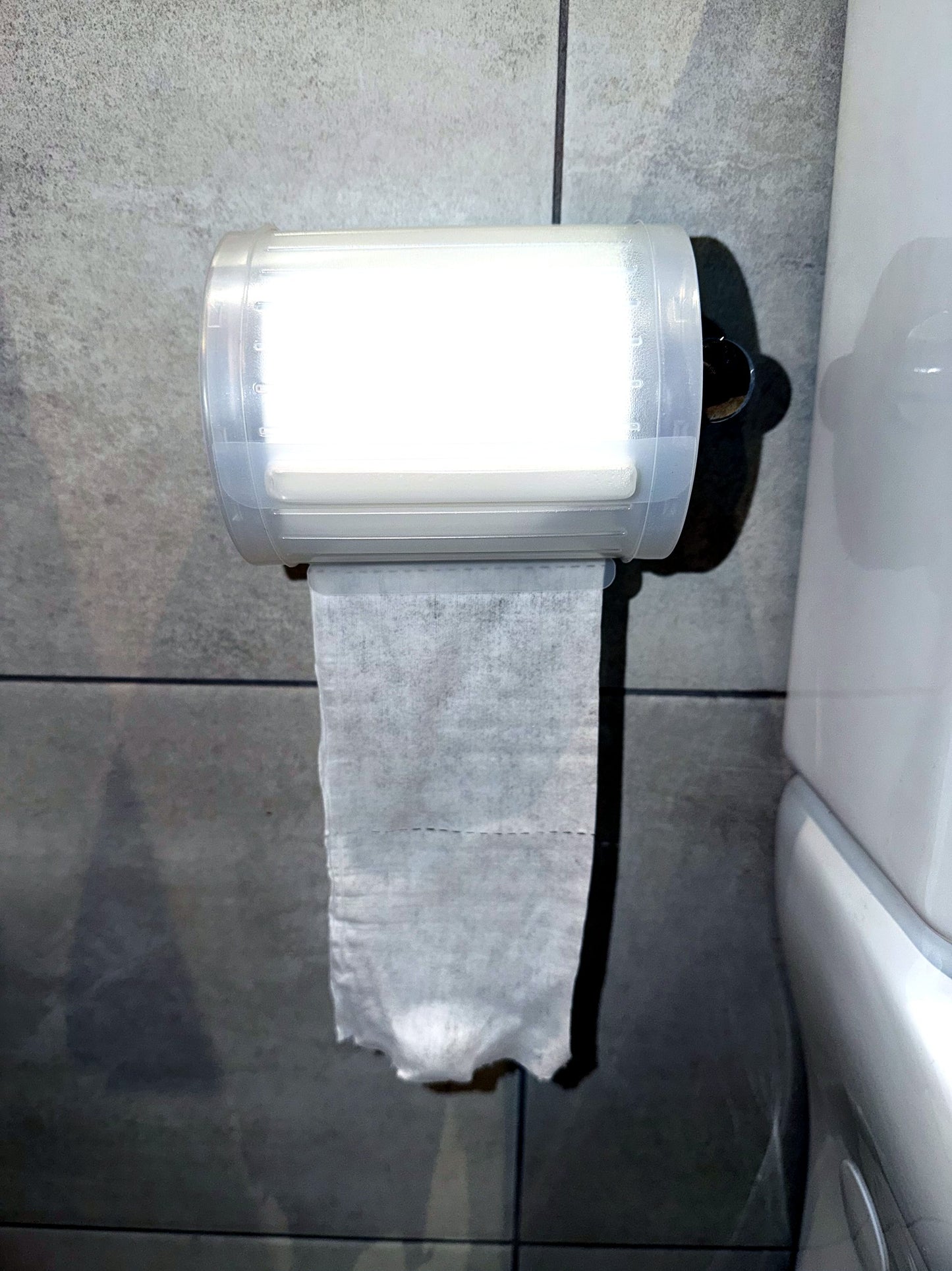 Wipeez roll mounted on bathroom wall