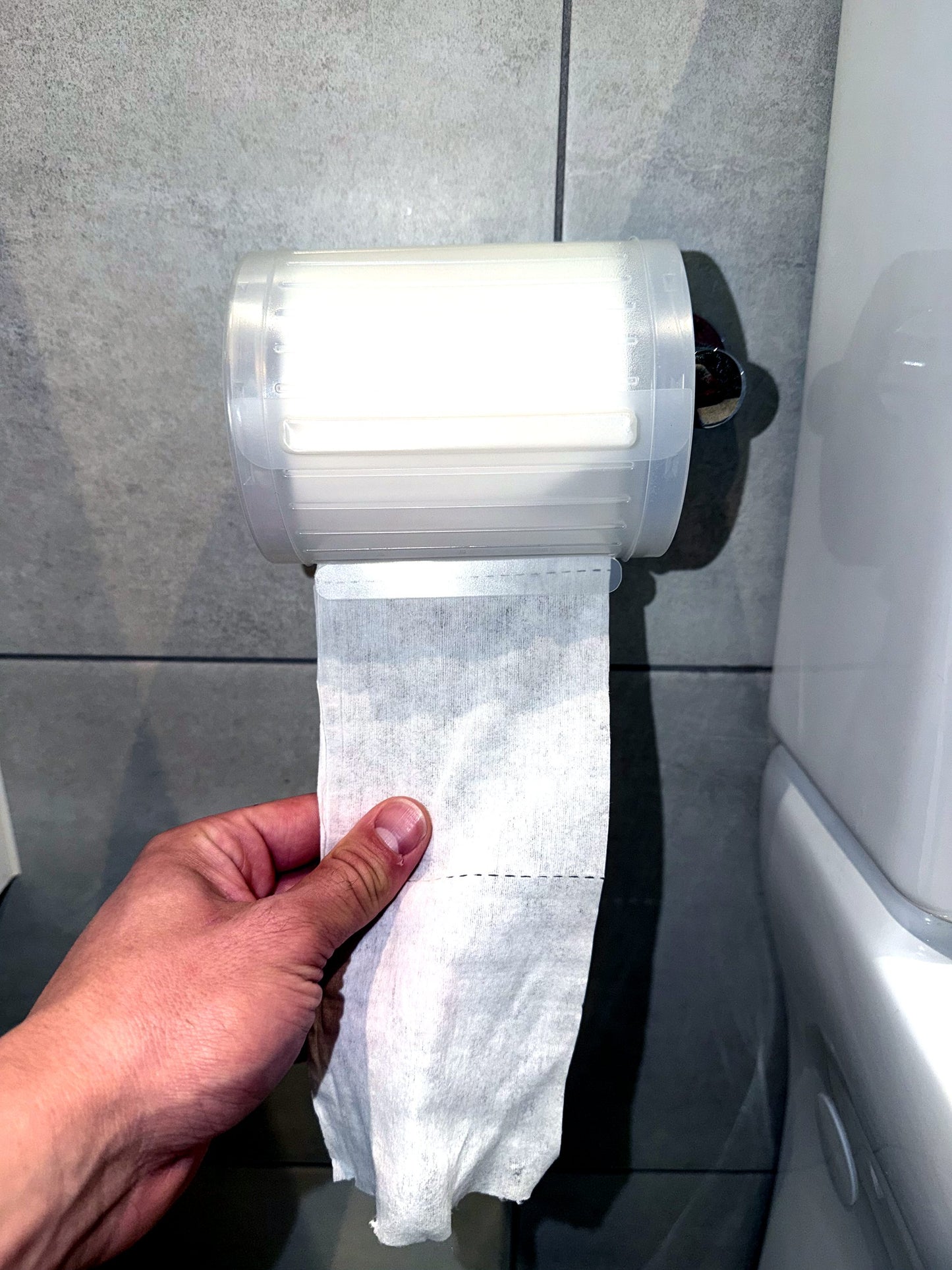 Pulling a Wipeez wet wipe from the roll